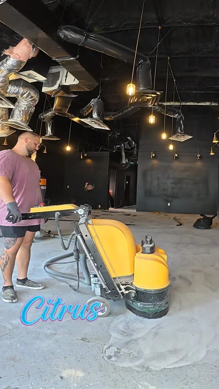 Commercial diamond grinder profiling a concrete floor