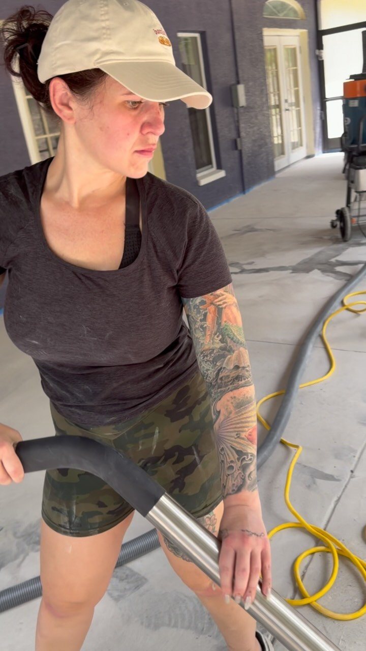 Kali running the grinder during floor prep